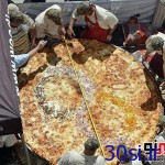 پخت بزرگترین پیتزای جهان/عکس